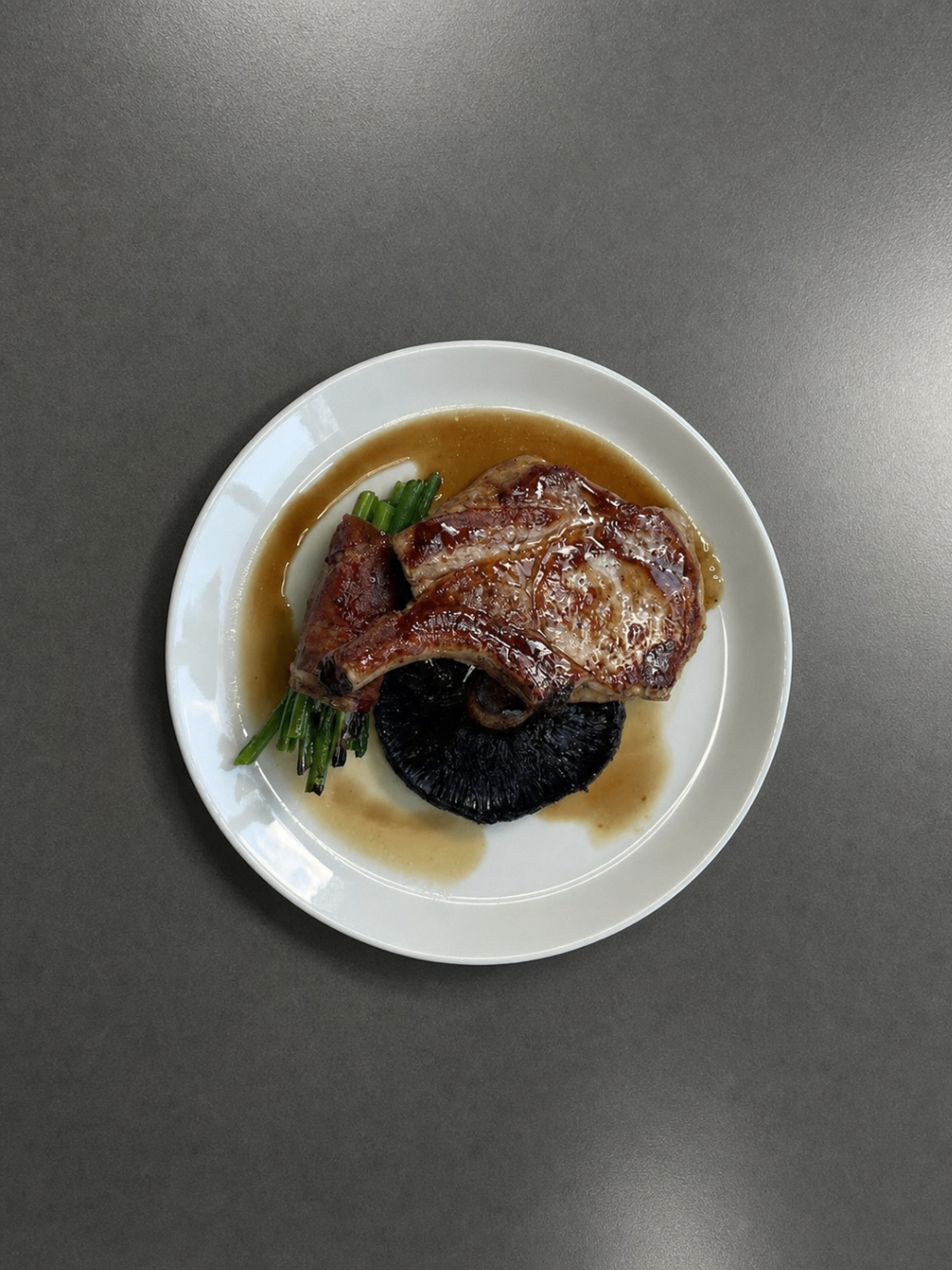Grilled beef and roast vegetables plated for a remote camp dinner service